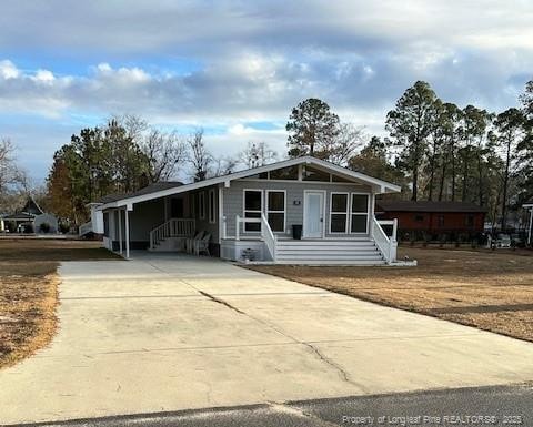 view of front of home featuring a carport