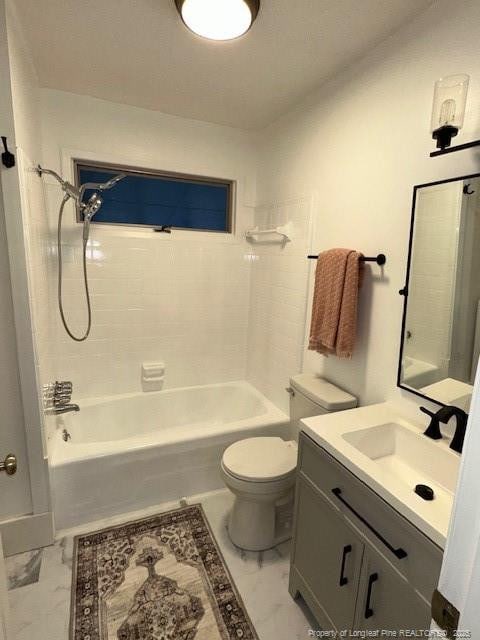 full bathroom with vanity, toilet, and tiled shower / bath