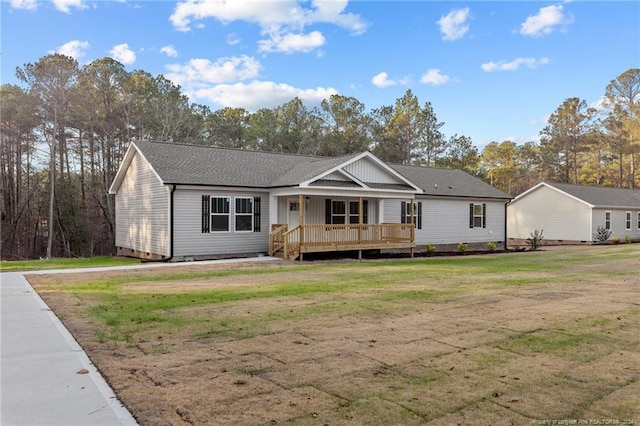 single story home with a front lawn and a deck