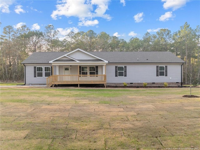 back of property with a deck and a lawn