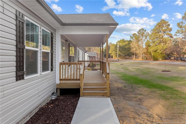 wooden terrace with a yard