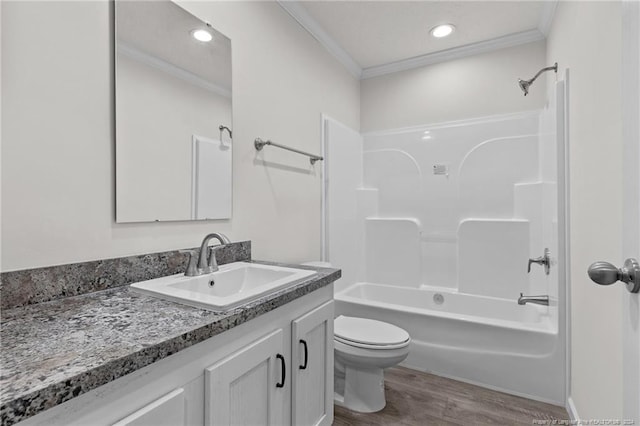 full bathroom with vanity,  shower combination, hardwood / wood-style flooring, and ornamental molding