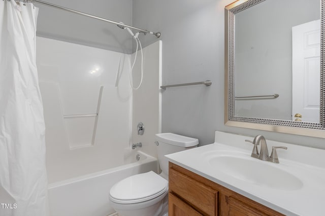 full bath with vanity, shower / bath combo with shower curtain, and toilet