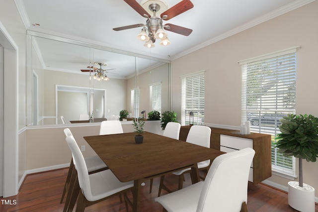 dining room with baseboards, ornamental molding, and wood finished floors