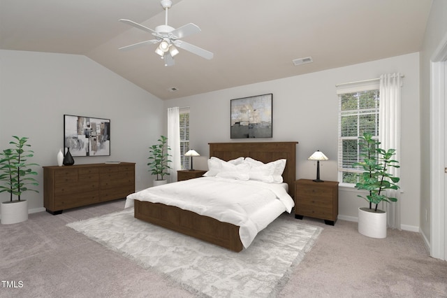 bedroom with visible vents, vaulted ceiling, carpet flooring, and ceiling fan