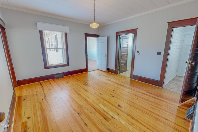 interior space featuring hardwood / wood-style floors and crown molding