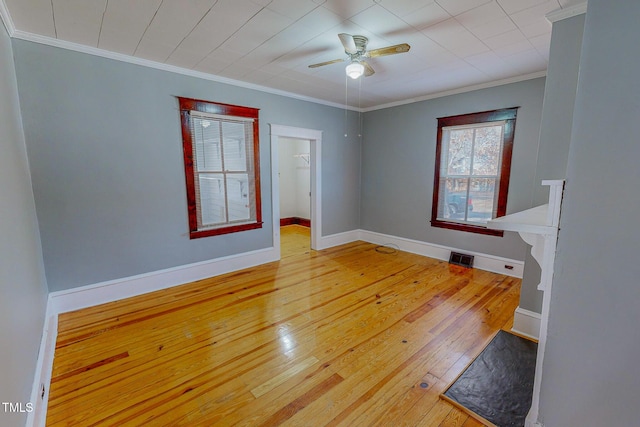 unfurnished room with hardwood / wood-style flooring, ceiling fan, and ornamental molding