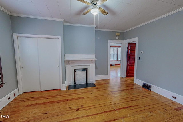 unfurnished living room with ceiling fan, light wood-type flooring, and crown molding