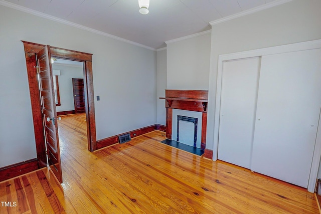 living room featuring crown molding and wood-type flooring