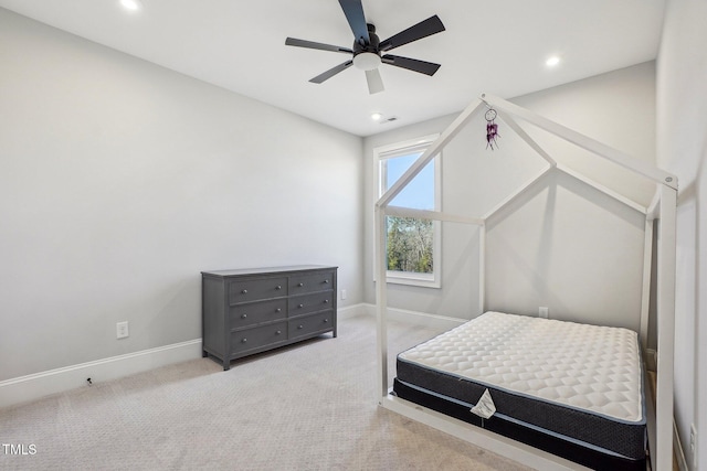 bedroom with light carpet and ceiling fan