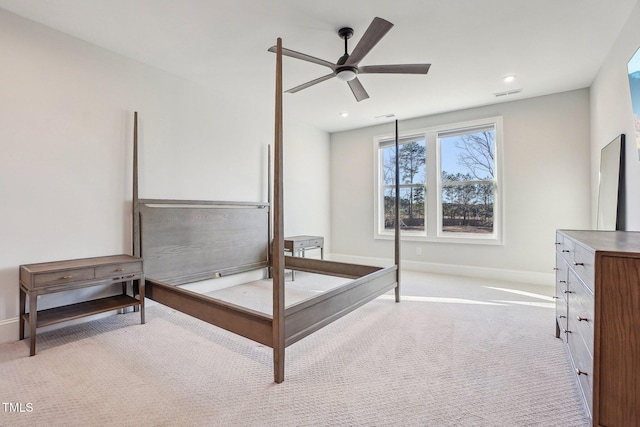 bedroom featuring ceiling fan and light colored carpet