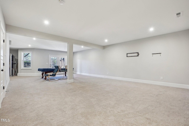 interior space with light colored carpet, french doors, and pool table