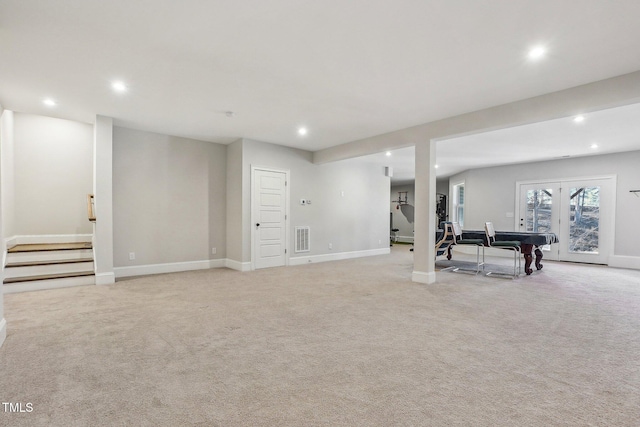 basement featuring light carpet and pool table