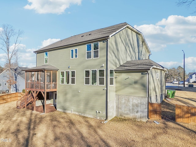 rear view of house with a sunroom