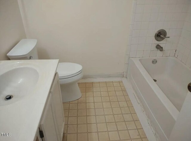 full bathroom featuring vanity, toilet, and tiled shower / bath combo