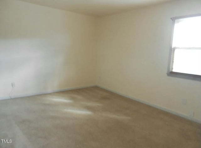 carpeted spare room with plenty of natural light