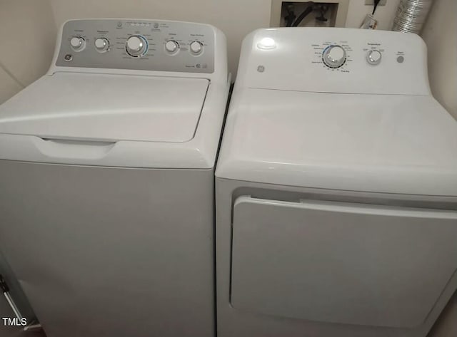 clothes washing area featuring washing machine and dryer