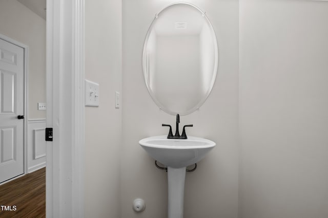 bathroom with hardwood / wood-style flooring