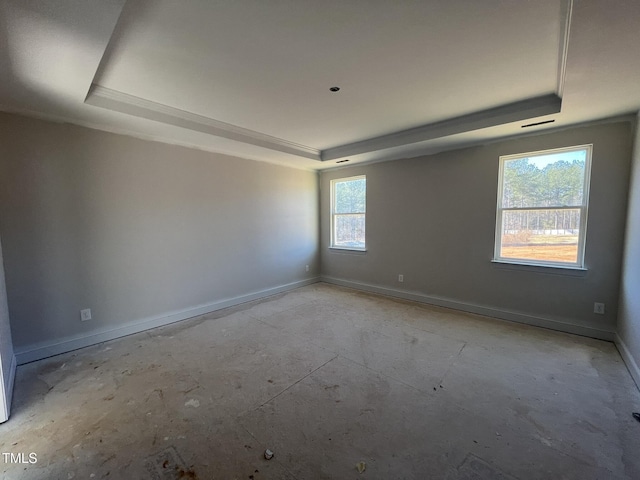 spare room featuring a tray ceiling