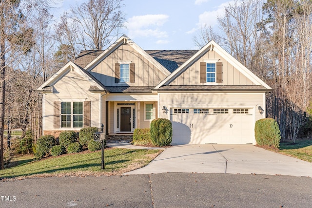 craftsman house with a front yard and a garage