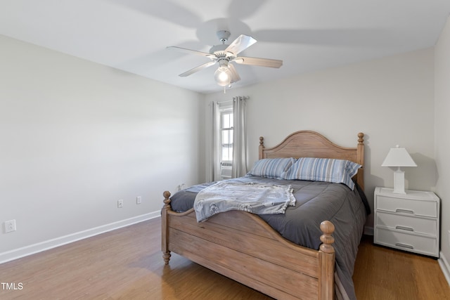 bedroom with hardwood / wood-style floors and ceiling fan