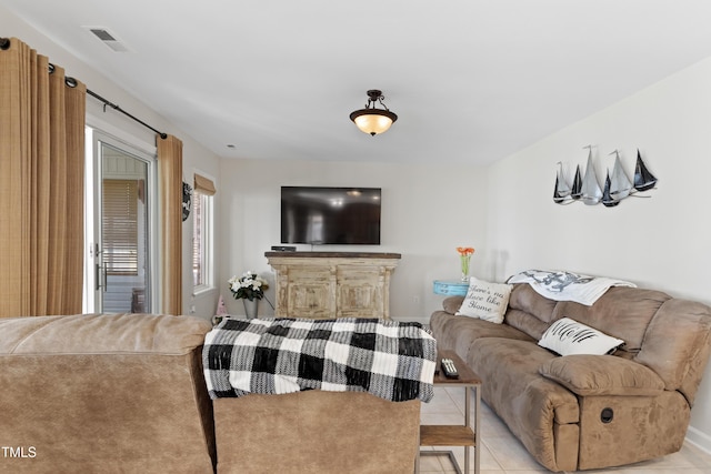 living room with light tile patterned floors