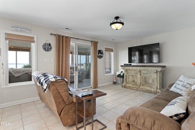 living room with light tile patterned floors