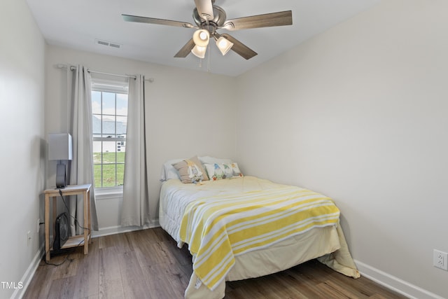 bedroom featuring hardwood / wood-style flooring and ceiling fan