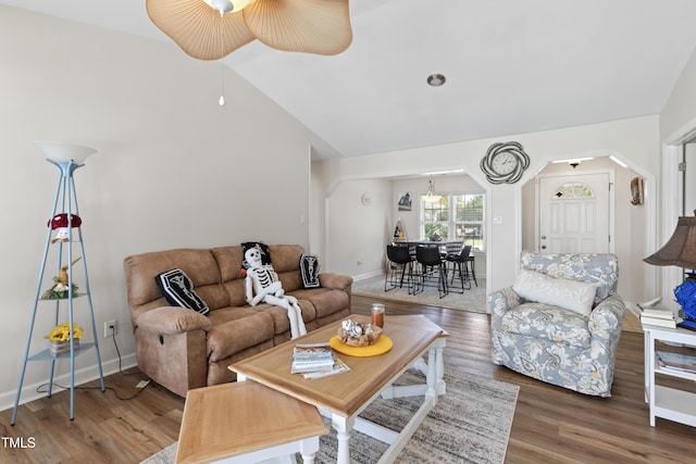 living room with hardwood / wood-style floors, ceiling fan, and lofted ceiling