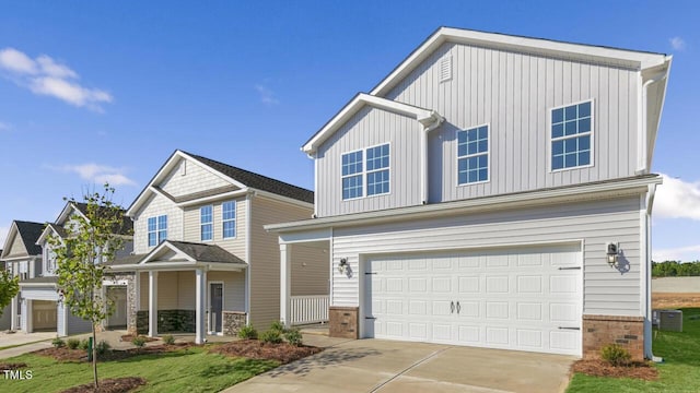 view of front facade featuring central AC unit and a garage