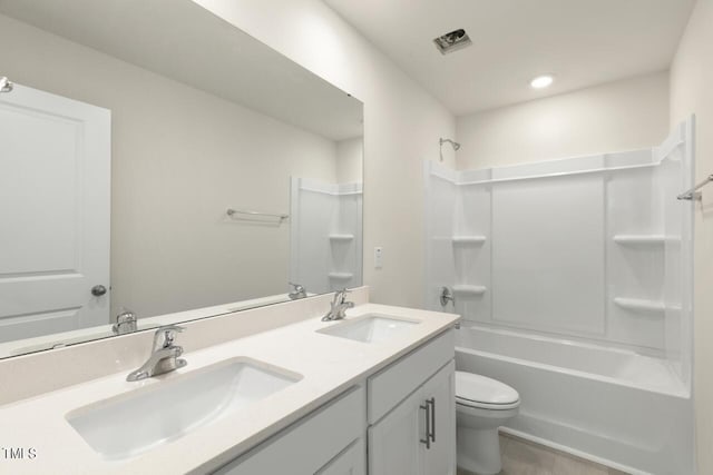 full bathroom with shower / bathing tub combination, vanity, and toilet