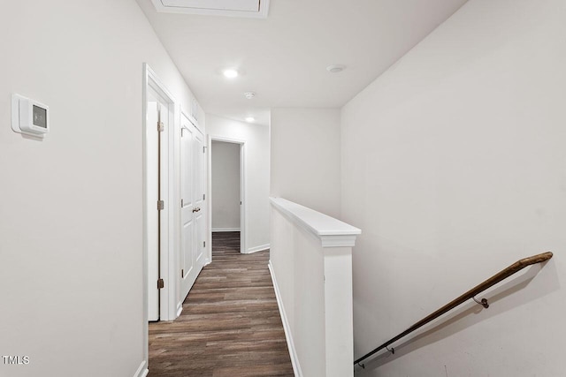 hallway with dark hardwood / wood-style flooring