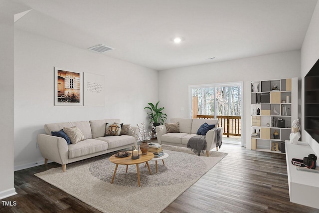 living room featuring dark wood-type flooring