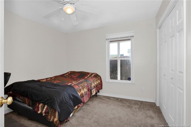 58 Bayleaf Ln, Sanford, NC 27332 - bedroom with a ceiling fan, carpet, a closet, and baseboards