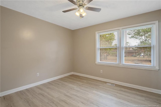 unfurnished room featuring light hardwood / wood-style flooring and ceiling fan