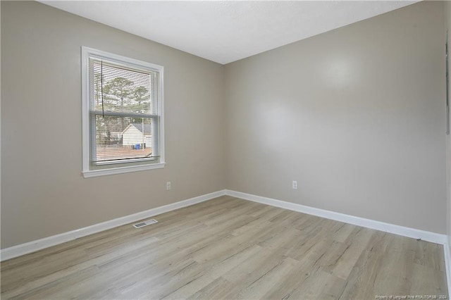 unfurnished room featuring light hardwood / wood-style flooring