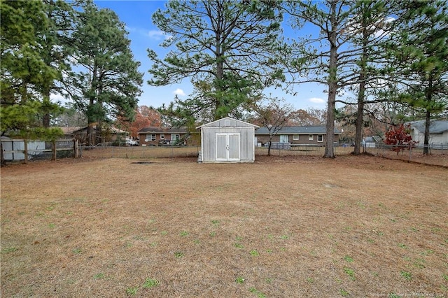 view of yard with a storage unit