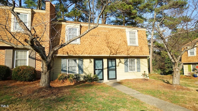 view of front of property with a front lawn