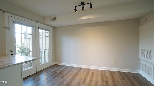 unfurnished dining area with hardwood / wood-style floors