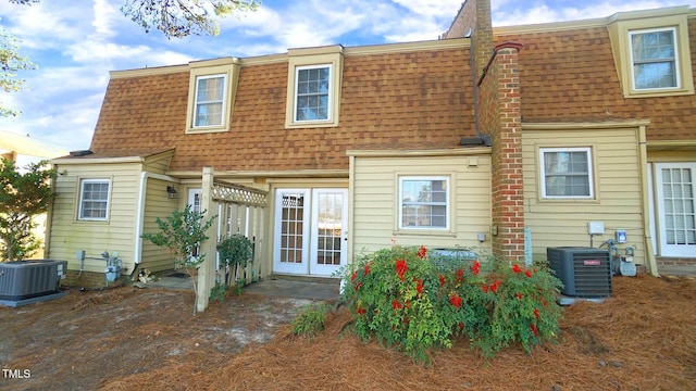 back of property featuring cooling unit