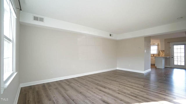 unfurnished room featuring wood-type flooring