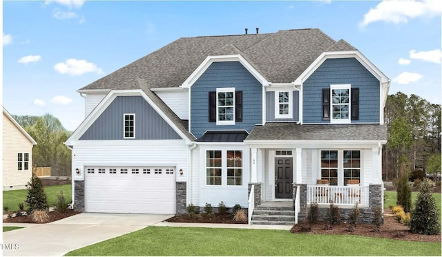 craftsman-style home featuring a porch, a garage, and a front lawn