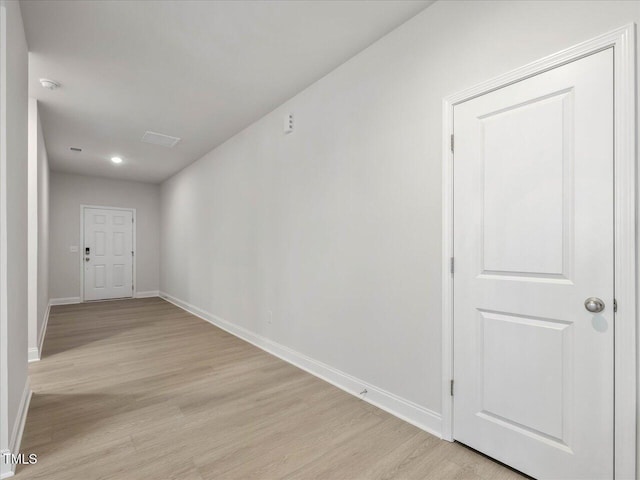 spare room featuring light hardwood / wood-style flooring