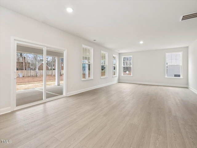 unfurnished living room featuring light hardwood / wood-style floors