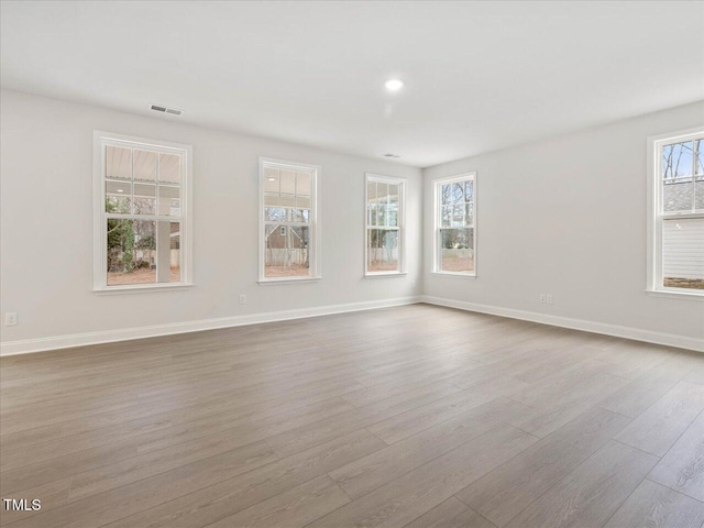 unfurnished room featuring light wood-type flooring