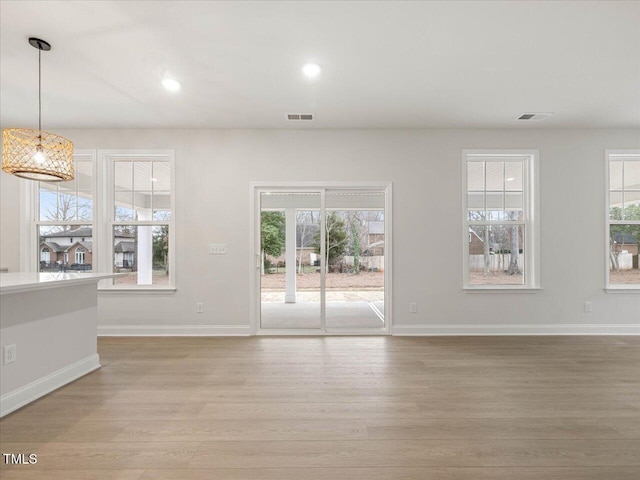 unfurnished living room with light hardwood / wood-style floors