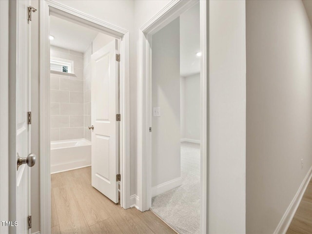 hallway featuring light hardwood / wood-style flooring