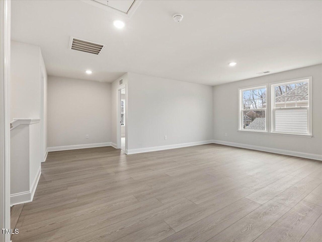 unfurnished room featuring light hardwood / wood-style flooring