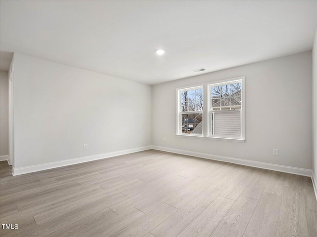 unfurnished room with light hardwood / wood-style floors