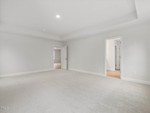 unfurnished room with light colored carpet